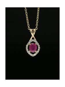 Ruby & Diamond Oval Halo Pendant Necklace in 9ct Yellow Gold
