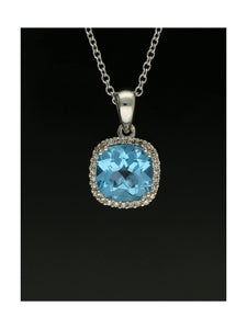 Blue Topaz & Diamond Cushion Cut Halo Pendant Necklace in 9ct White Gold