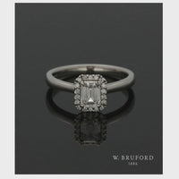 Diamond Halo Engagement Ring 0.70ct Certificated Emerald Cut in Platinum