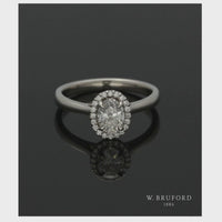 Diamond Halo Engagement Ring 0.70ct Certificated Oval Cut in Platinum