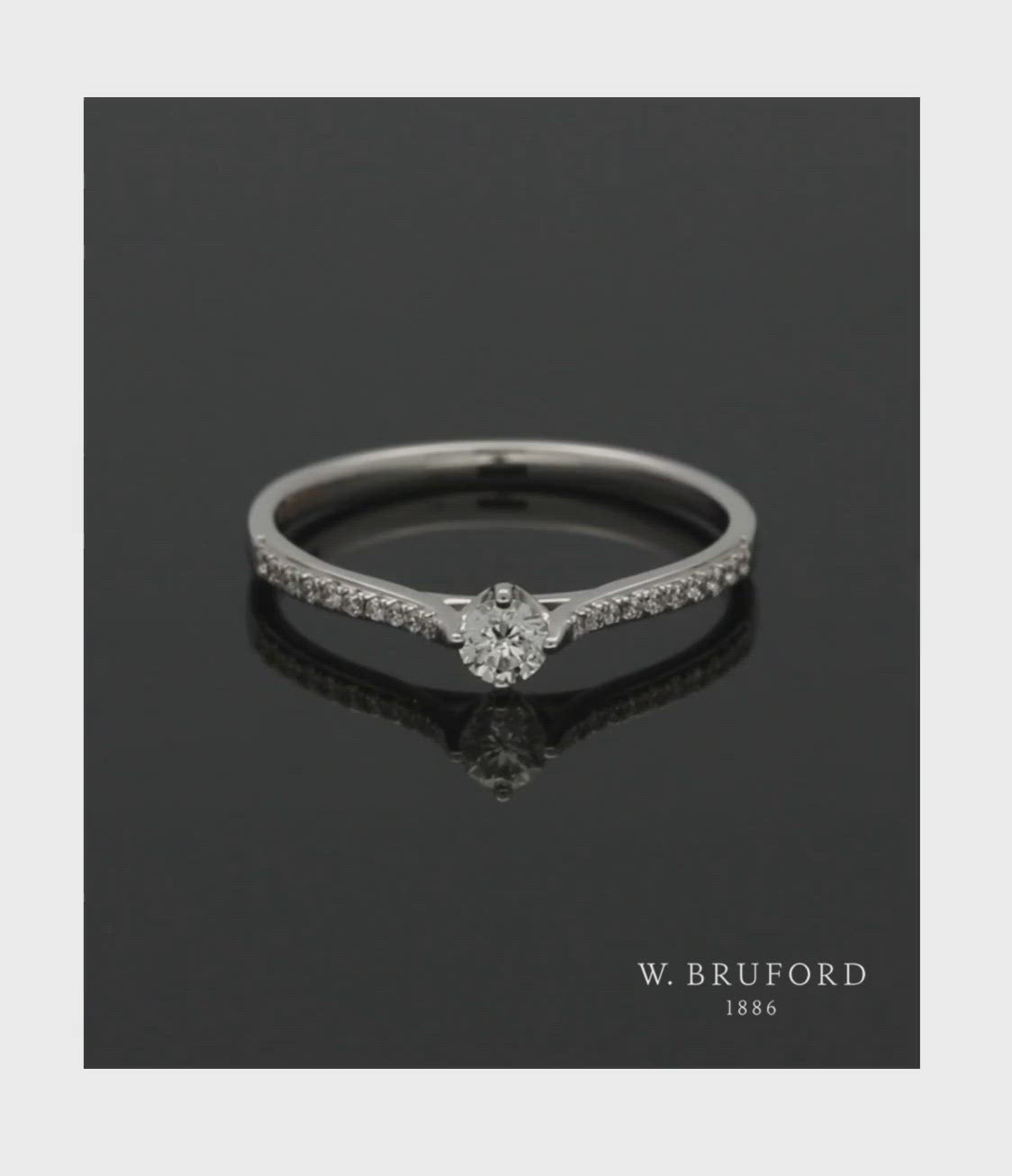  Diamond Solitaire Ring 0.15ct Round Brilliant Cut in 18ct White Gold with Diamond Shoulders